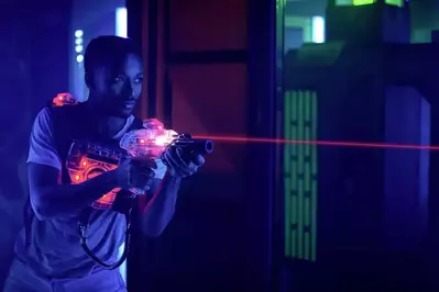 young man playing laser tag