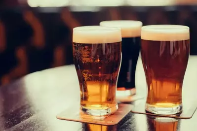 three different beer types on a round table 