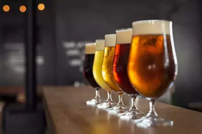 beer glasses on a wooden counter 