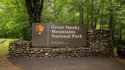 An entrance sign welcomes visitors to Great Smoky Mountains National Park.