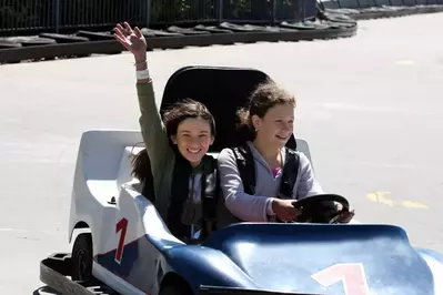 people riding go karts