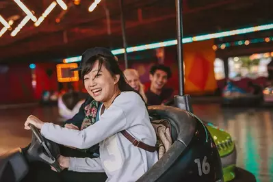 girl riding bumper cars