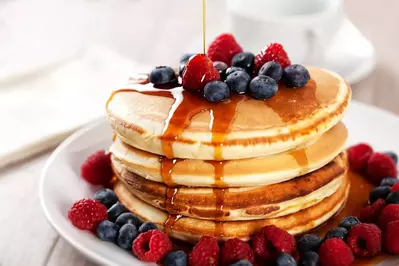 pancakes with berries and syrup