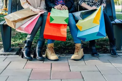 people with gift shop bags