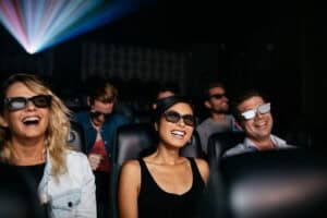 people wearing 3D glasses watching movie